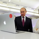 Vladimir Putin and Editor-in-chief of RT (Russia Today) Margarita Simonyan attend an exhibition marking RT’s 10th anniversary in Moscow, on December 10, 2015. (Mikhail Klimentyev/Sputnik, Kremlin Pool Photo via AP)